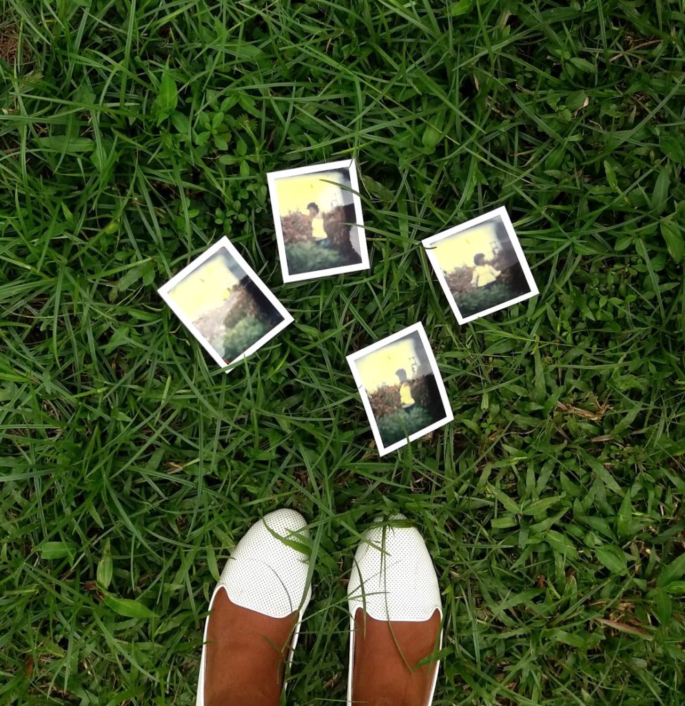 Polaroid Pictures On Grass And White Shoes 