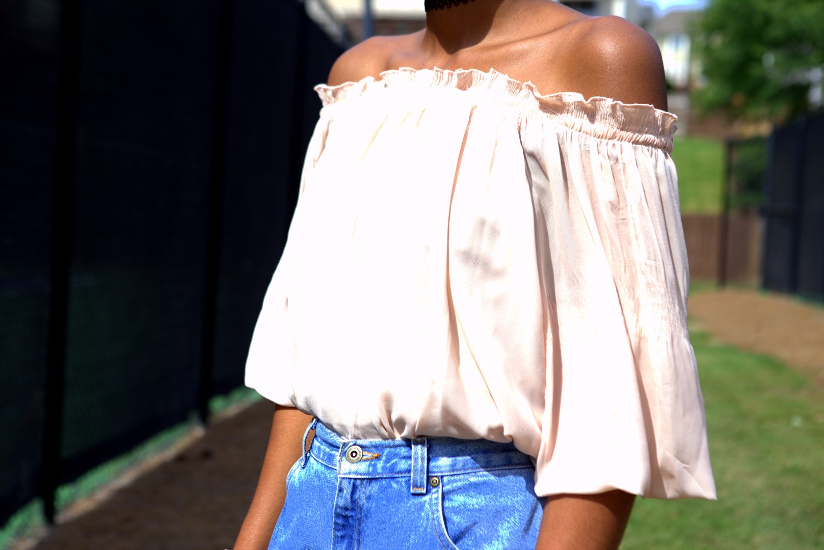 Nigerian fashion and life style Blogger Cassie Daves in brown frill off shoulder top and high waisted mom jeans