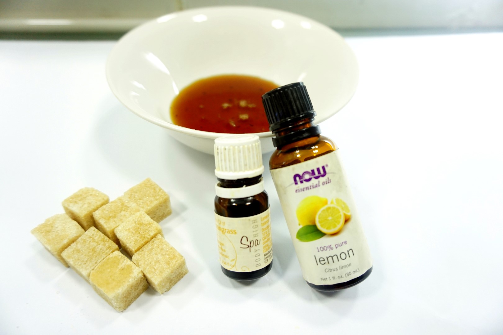 Essential oils, honey and brown sugar for homemade face mask and scrub 