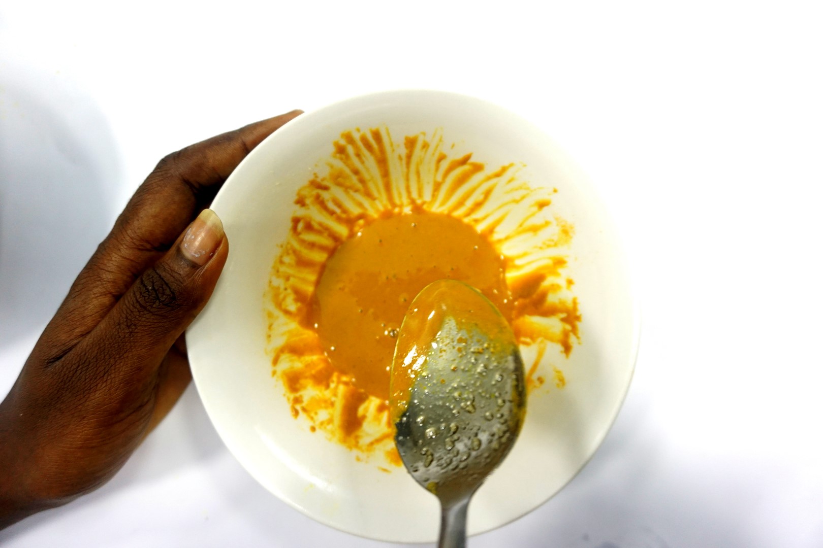 Turmeric and honey mixed together for DIY homemade face mask