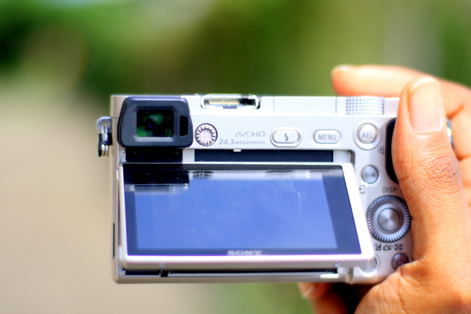 Sony Alpha A6000 front view showing tilted LCD Screen