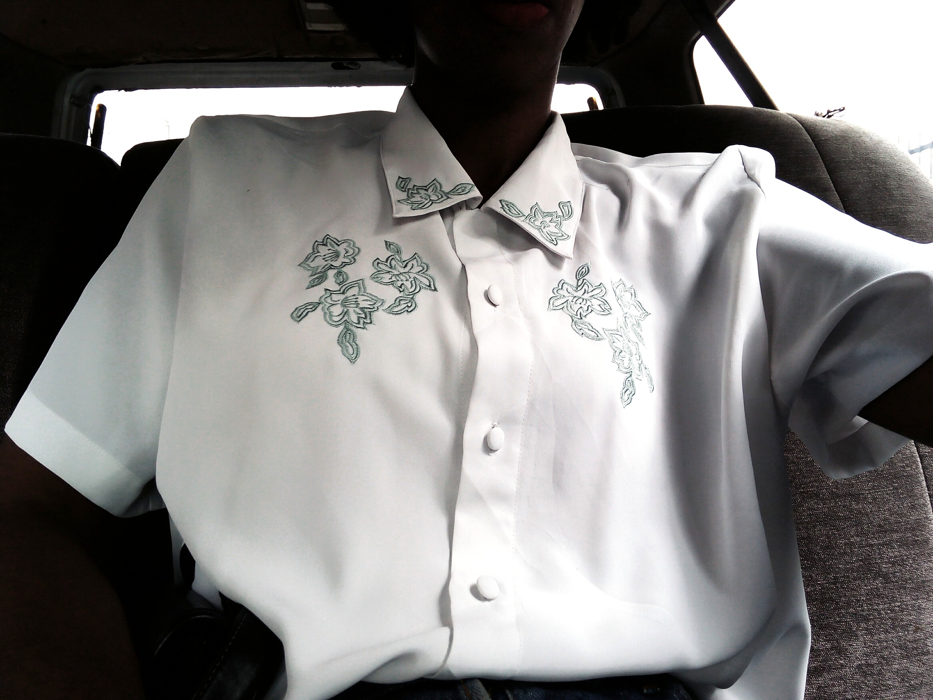 Wardrobe Essentials - Nigerian fashion blogger wearing a white vintage shirt with flowery print