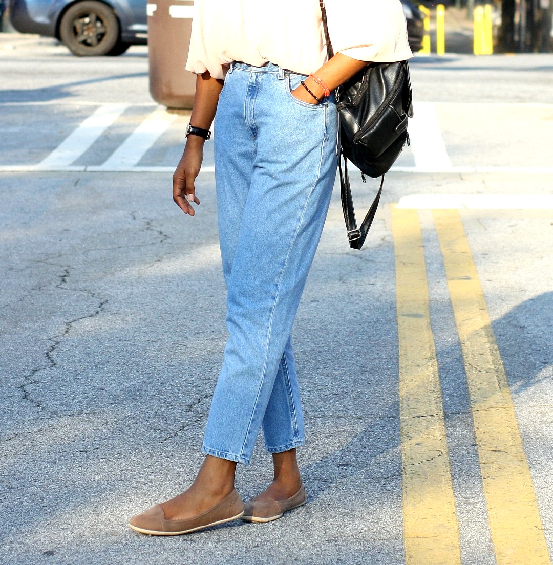 Wardrobe essentials - Nigerian fashion blogger Cassie Daves wearing a light blue mom jeans and brown flats