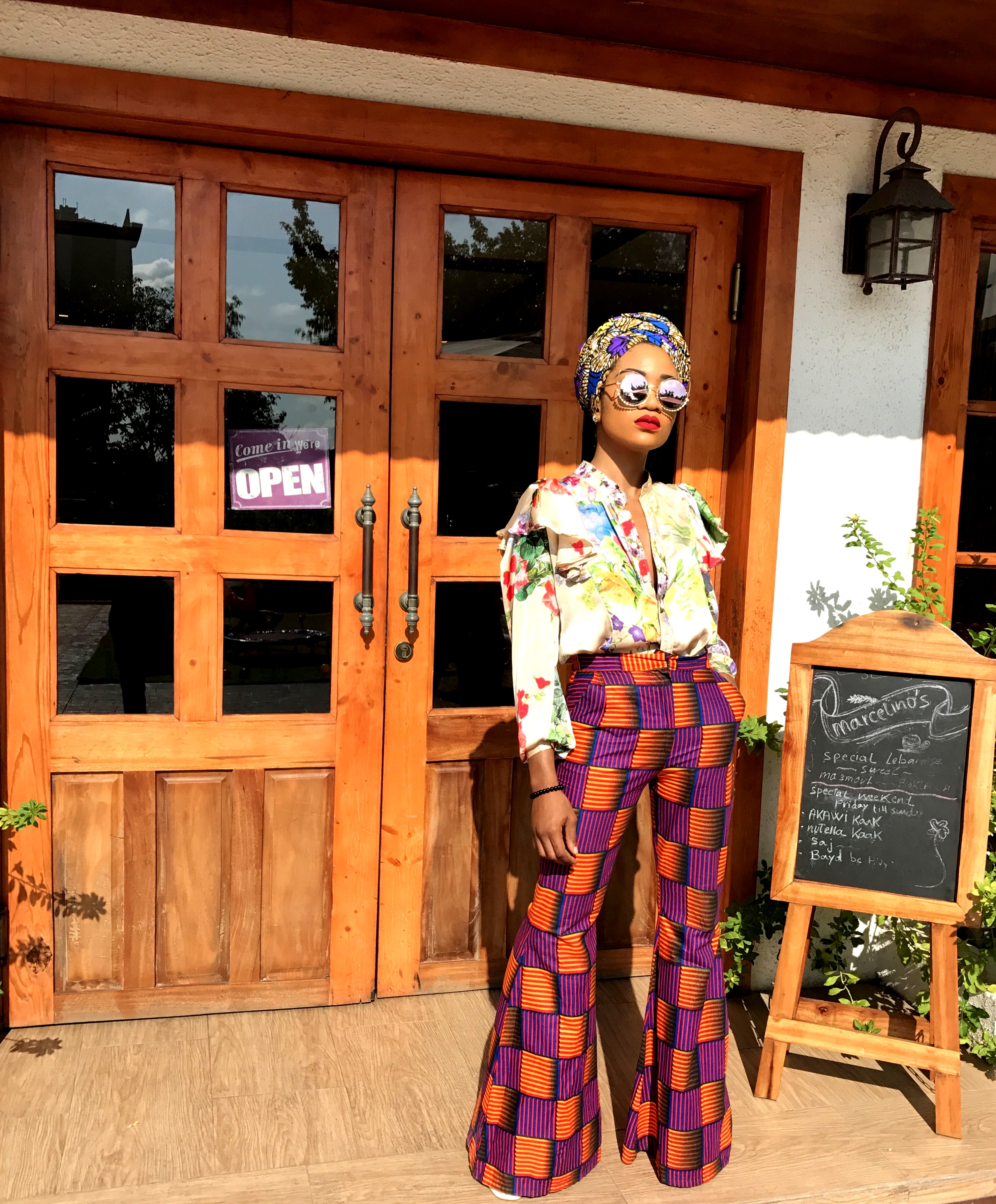 Nigerian fashionista jennifer oseh, theladyvhodka in ankara mixed prints and turban outfit
