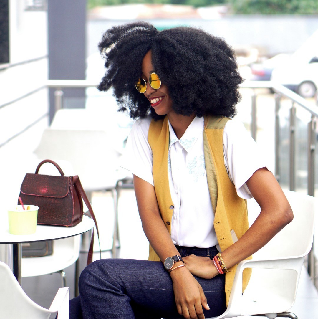 Nigerian Fashion blogger Cassie Daves sitting at a gelato shop in Lagos Nigeria 