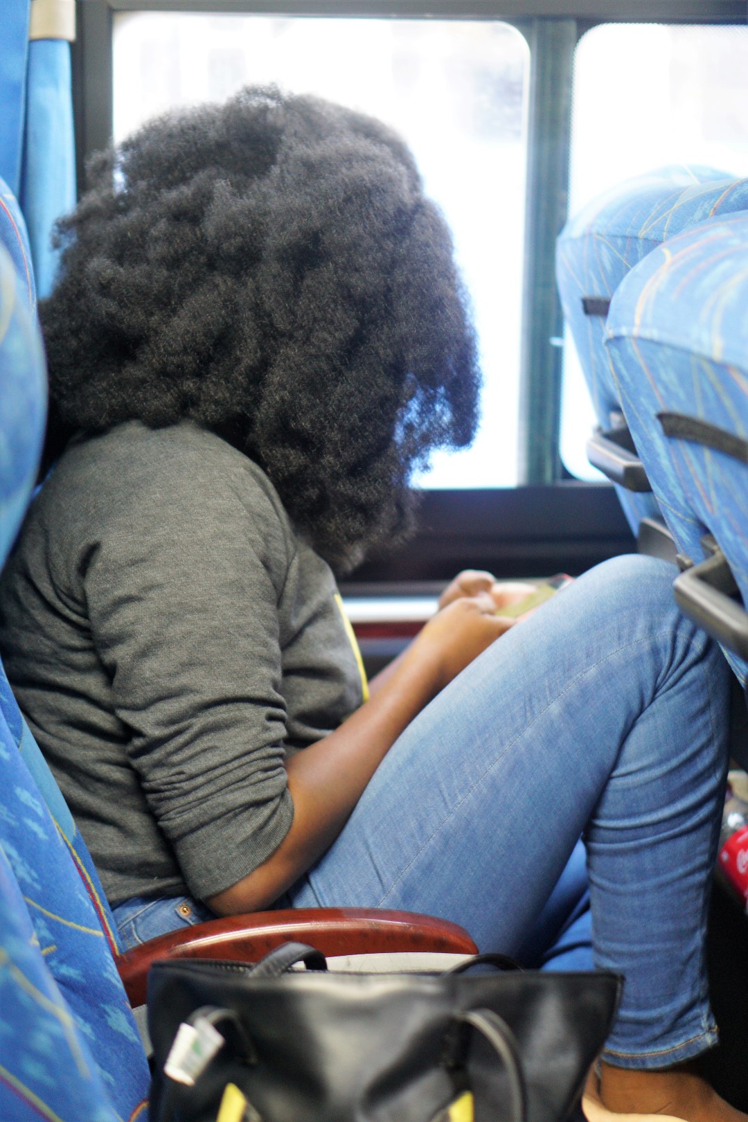 Nigerian beauty blogger Nappyhaired in an abc transport bus from lagos to ghana