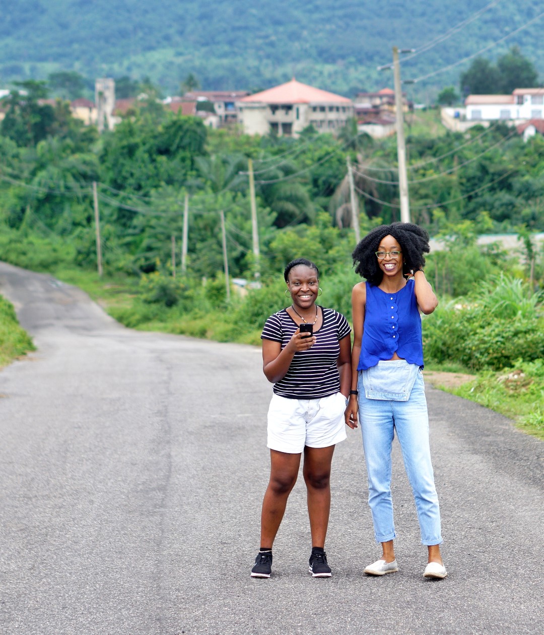 Nigerian Fashion blogger Cassie Daves and a friend at Erin Ijesha waterfall