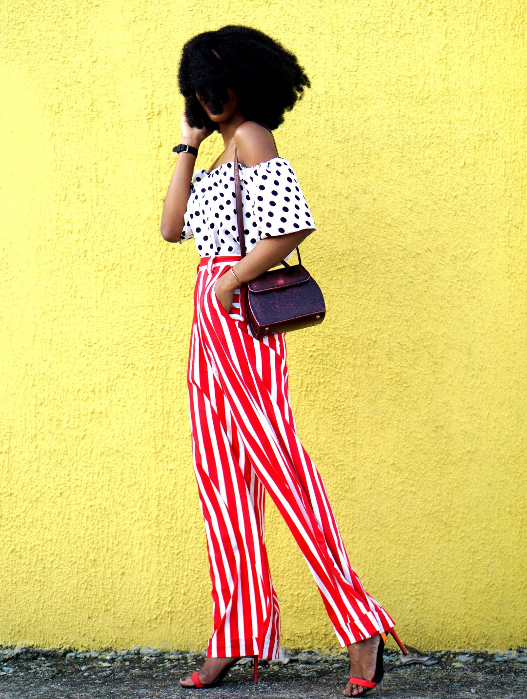 Mixed prints fashion trend : Nigerian fashion and lifestyle blogger Cassie Daves In a polka dot off shoulder top and striped pants