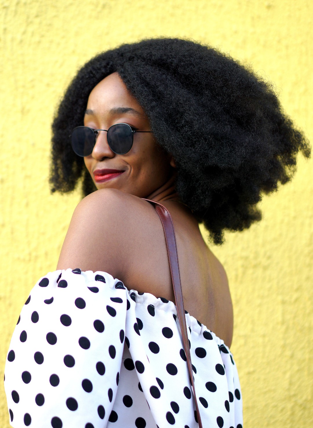 Nigerian fashion and lifestyle blogger Cassie Daves In a polka dot off shoulder top