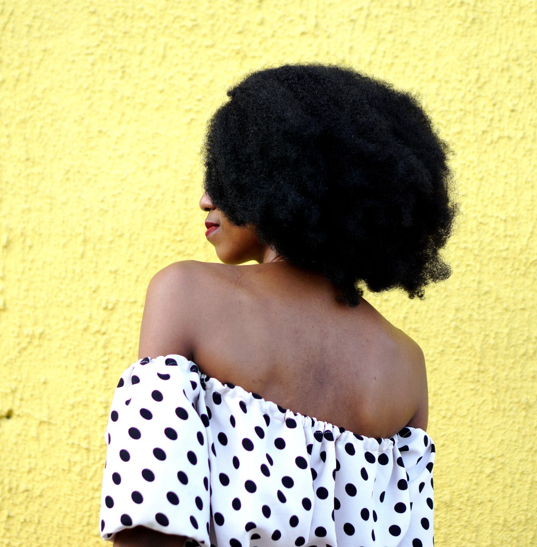 Nigerian fashion blogger Cassie Daves In a polka dot off shoulder top