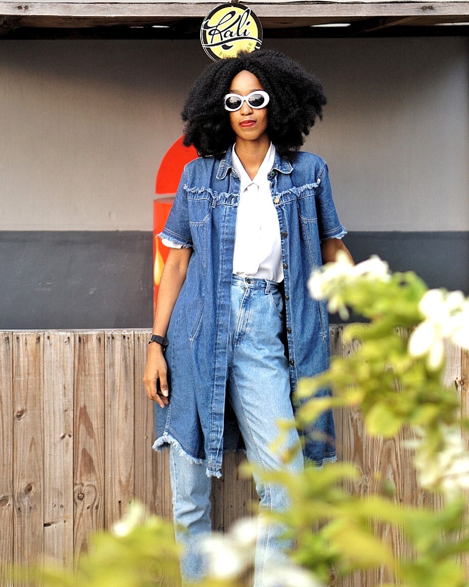 Nigerian fashion blogger cassie daves wearing double denim trend in denim dress and mom jeans