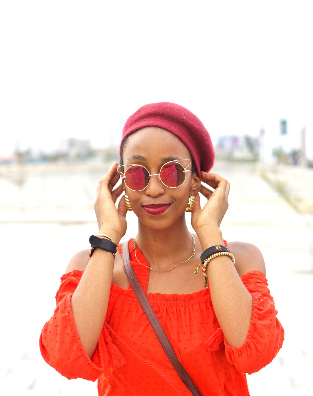 Nigerian blogger inwine red beret fashion trend