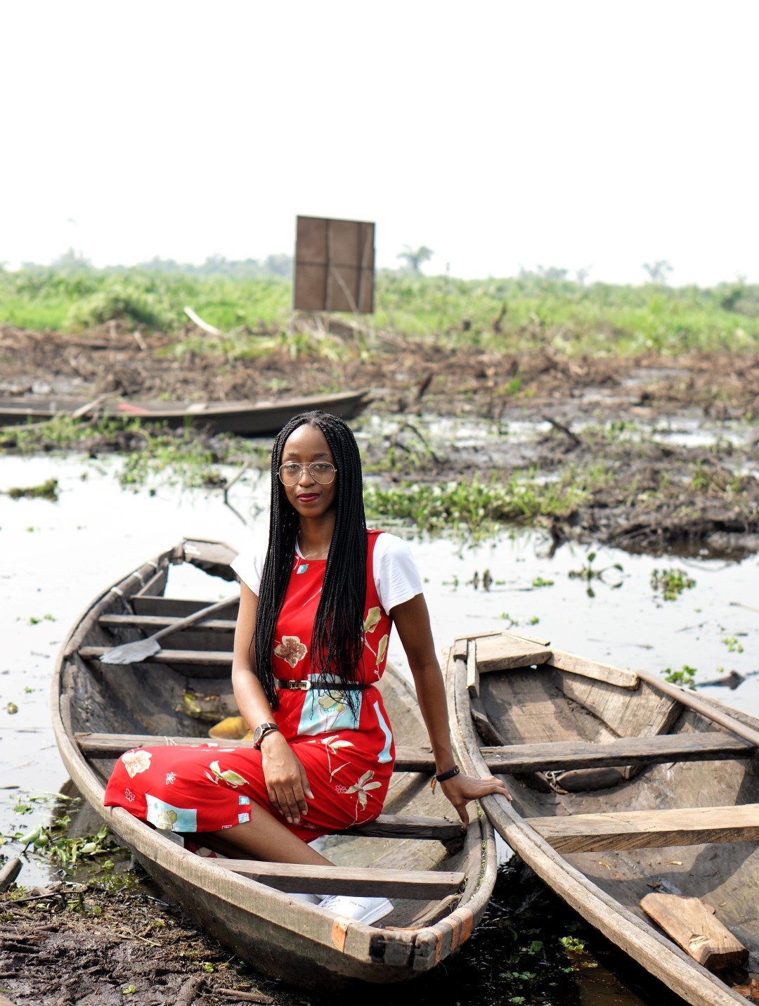  Cassie Daves sitting in a boat at the epe mangrove