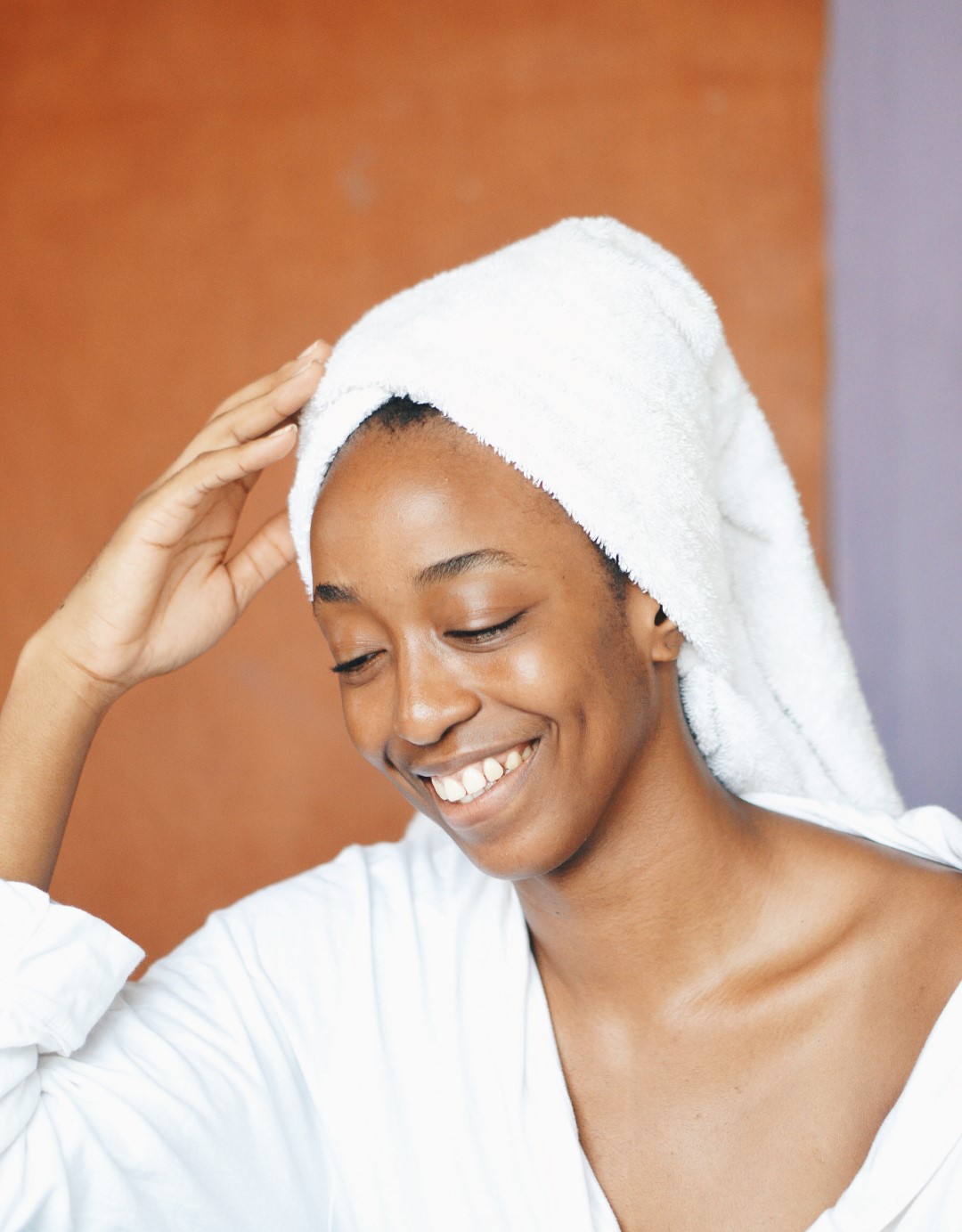 healthy skincare habits -Nigerian blogger Cassie Daves in a robe and towel turban
