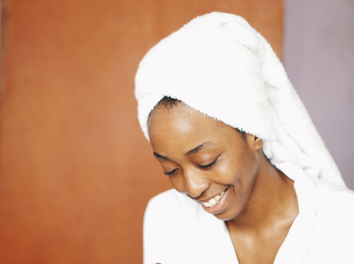 healthy skincare habits -Nigerian beauty blogger Cassie Daves in a robe and towel turban