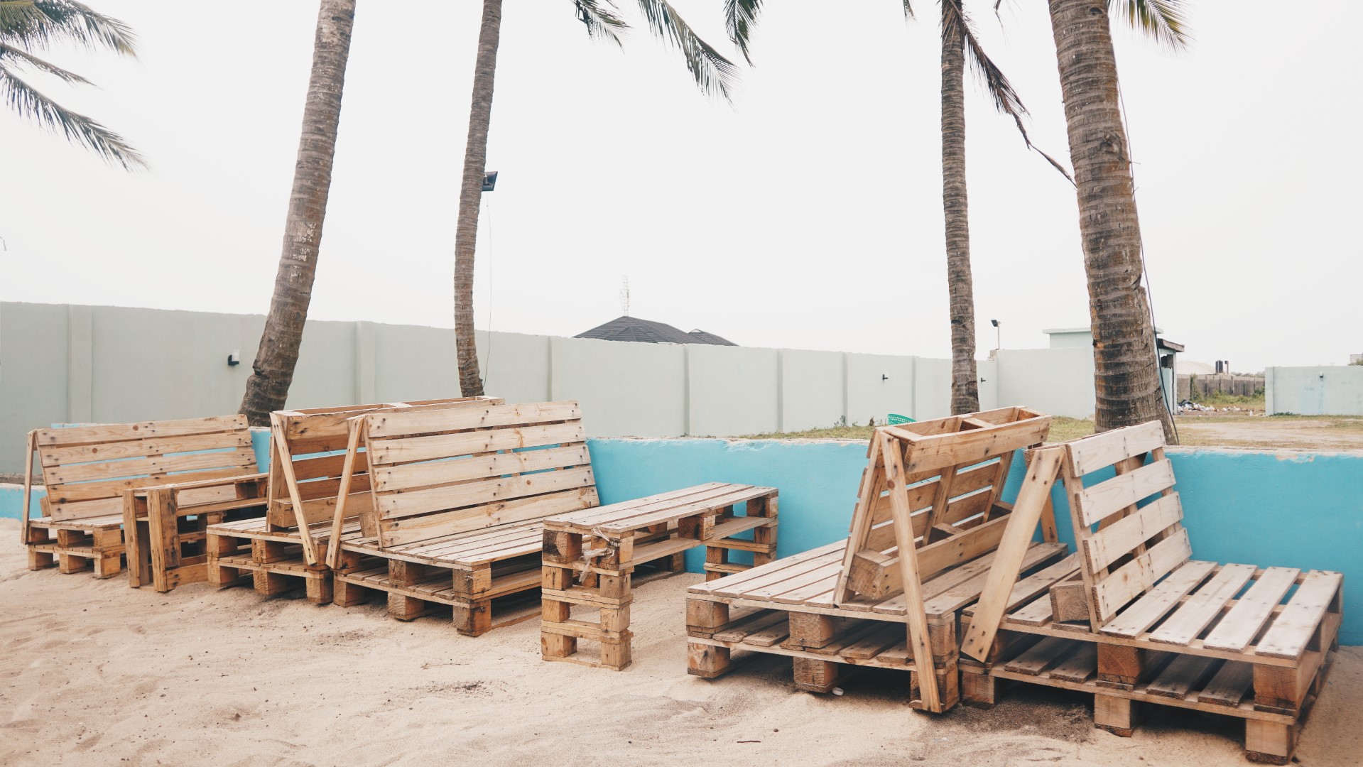 Wooden chairs at private beach in lekki - laguna beach lagos