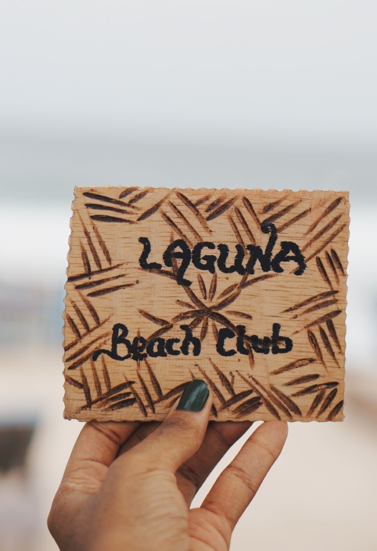 Wooden sign that reads as laguna beach lagos