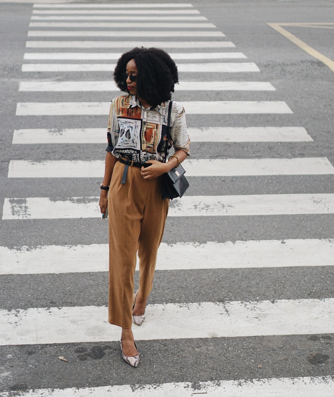 Nigerian blogger in high waist vintage pants and vintage print shirt