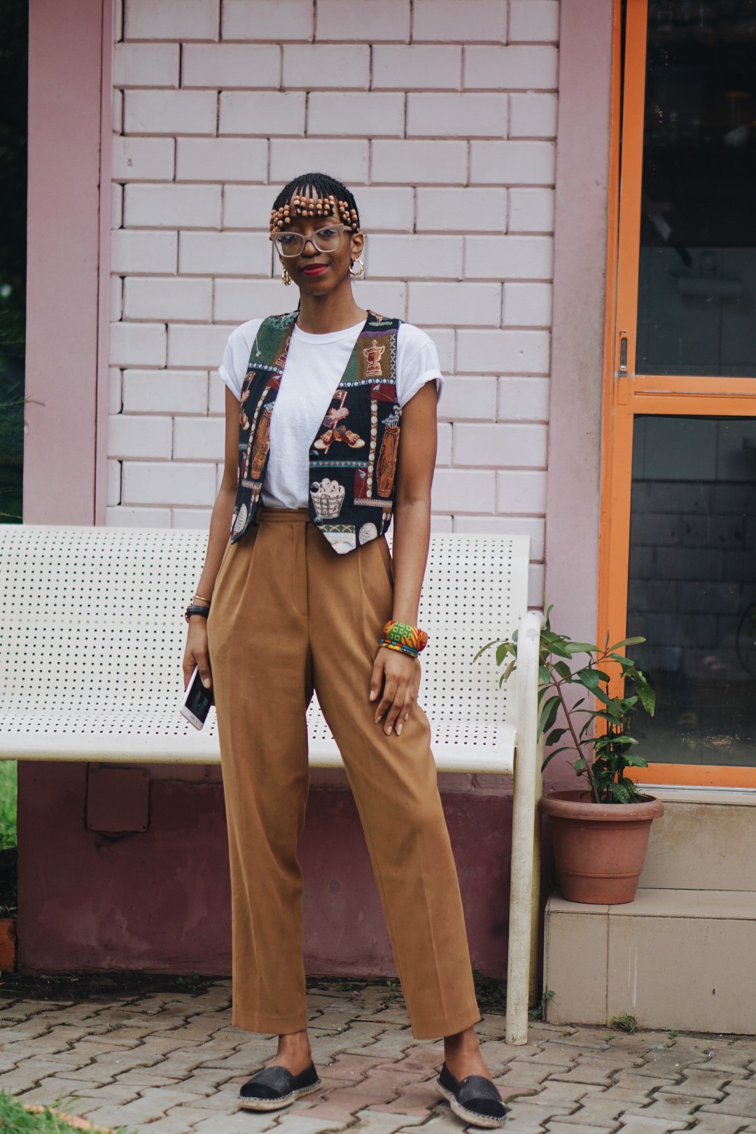Cassie Daves wearing a high waist vintage pants and retro waist coat
