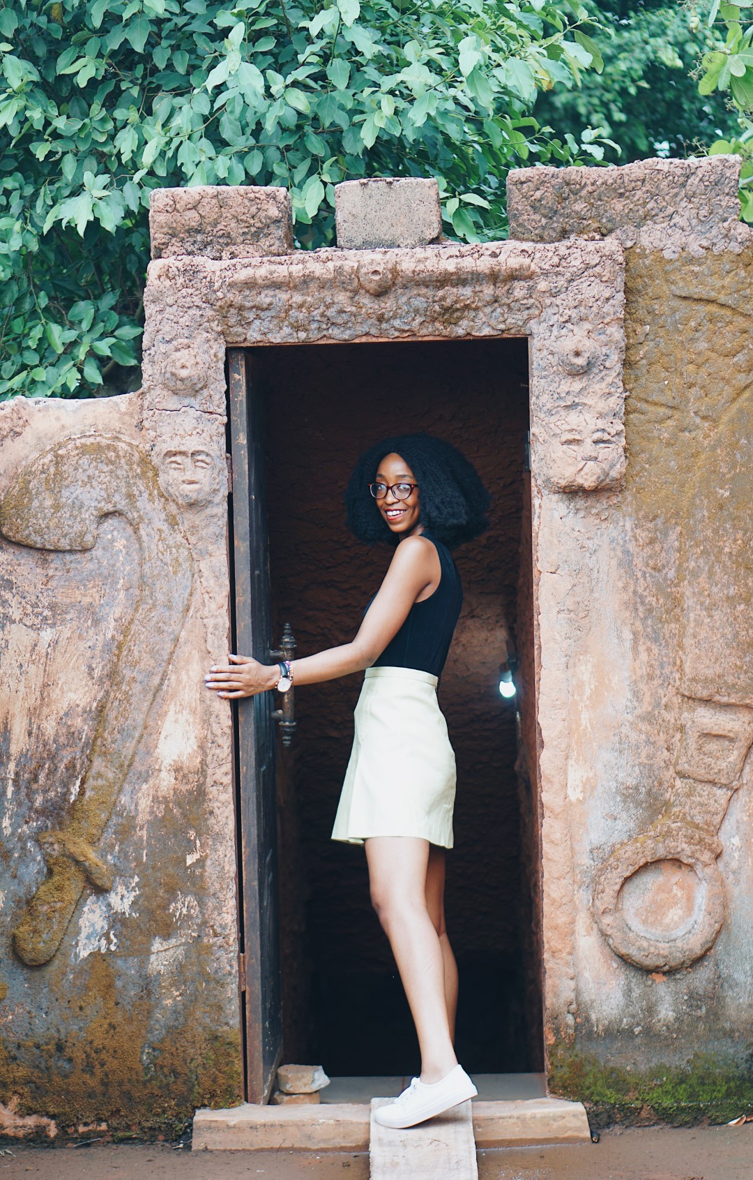 Nigerian Blogger Cassie Daves at the entrance to the tunnel at mount ned nwoko resort in idumuje ugboko