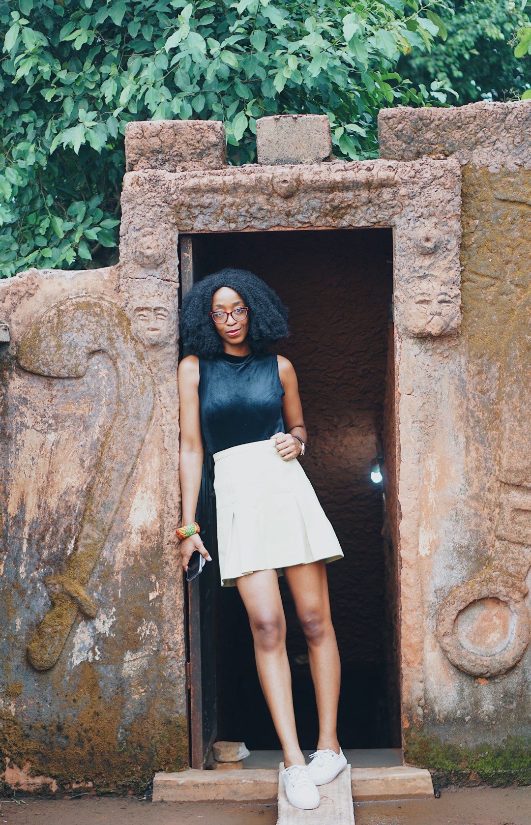 Blogger Cassie Daves at the entrance to the tunnel at mount ned nwoko resort in idumuje ugboko