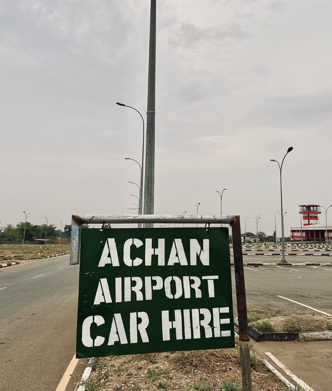 Achan Airport car hire sign post