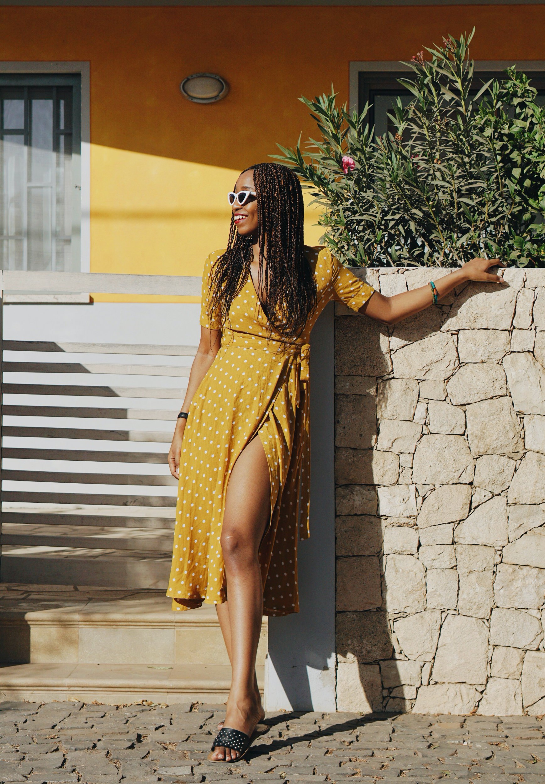 Travel blogger Cassie Daves in a Yellow polka dot dress in Cape Verde 