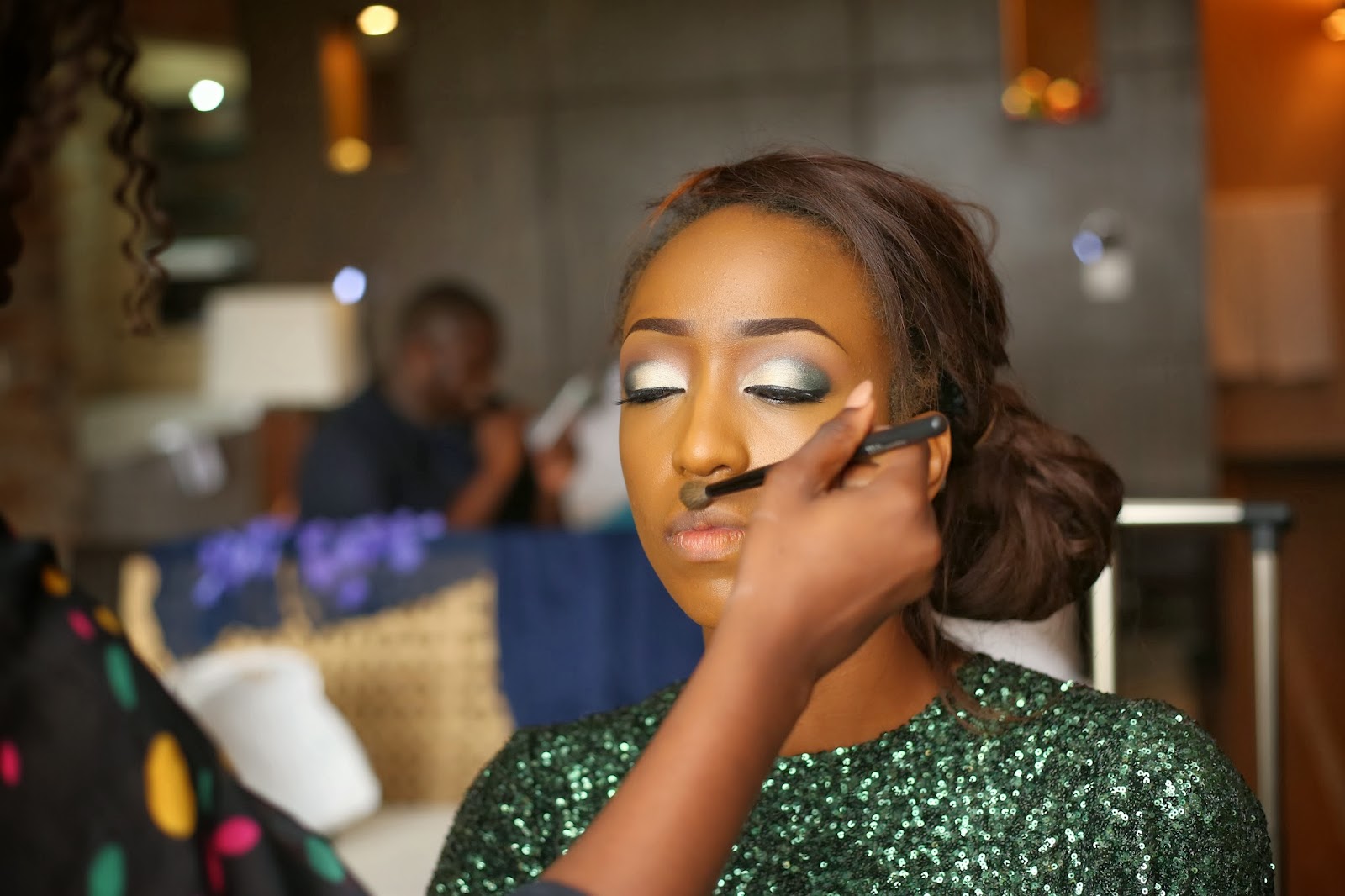 Nigerian model Cassie Daves getting her make up done 
