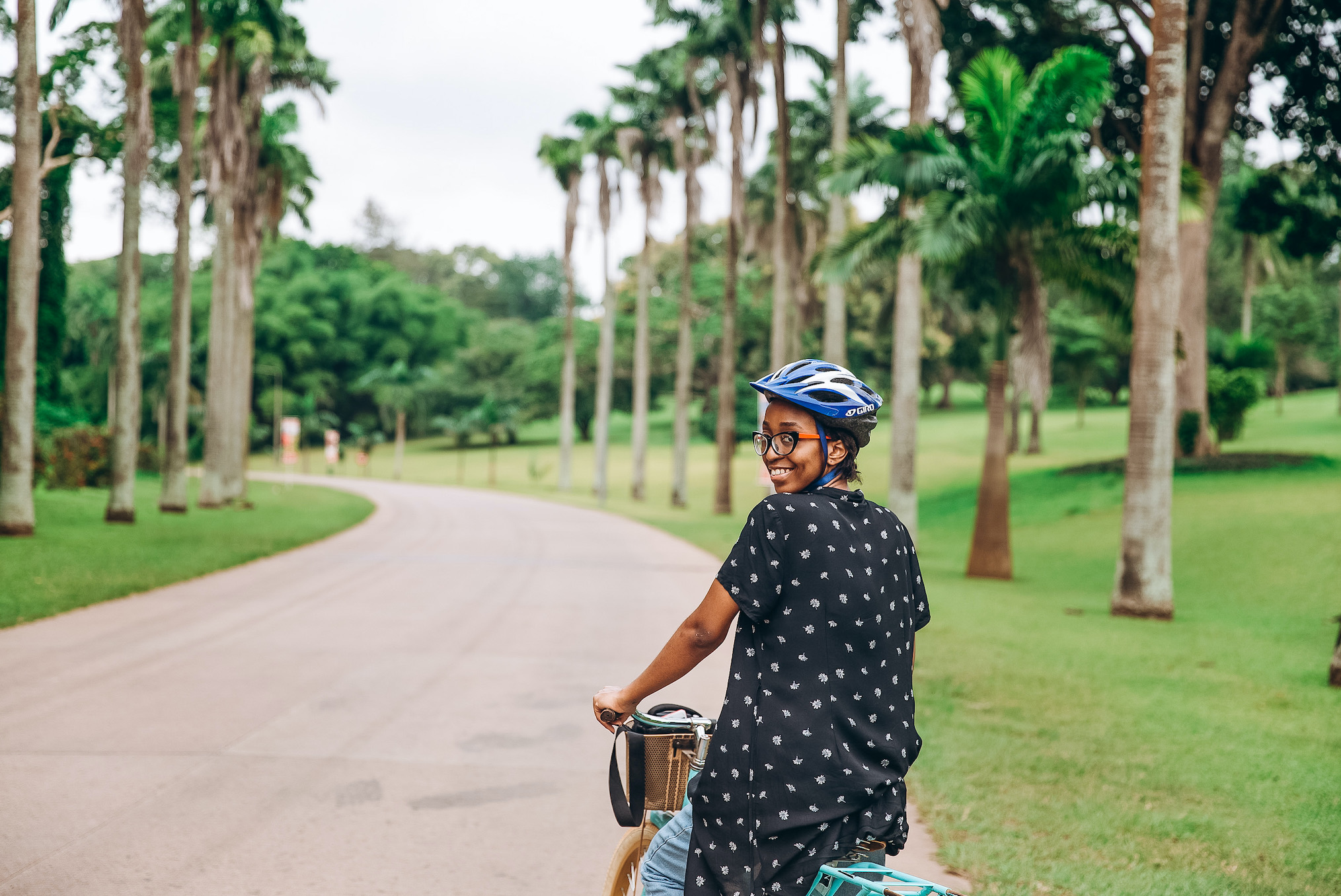 Cassie Daves riding a bicycle at IITA hotel ibadan