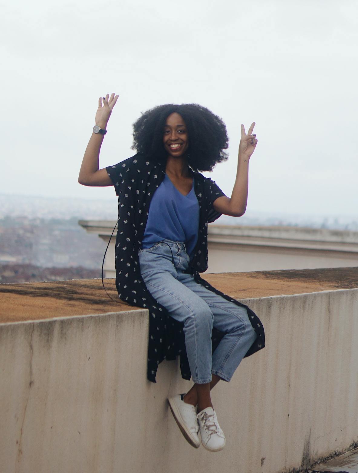 Nigerian lifestyle blogger Cassie Daves Sitting on the rooftop at Mapo hall Ibadan
