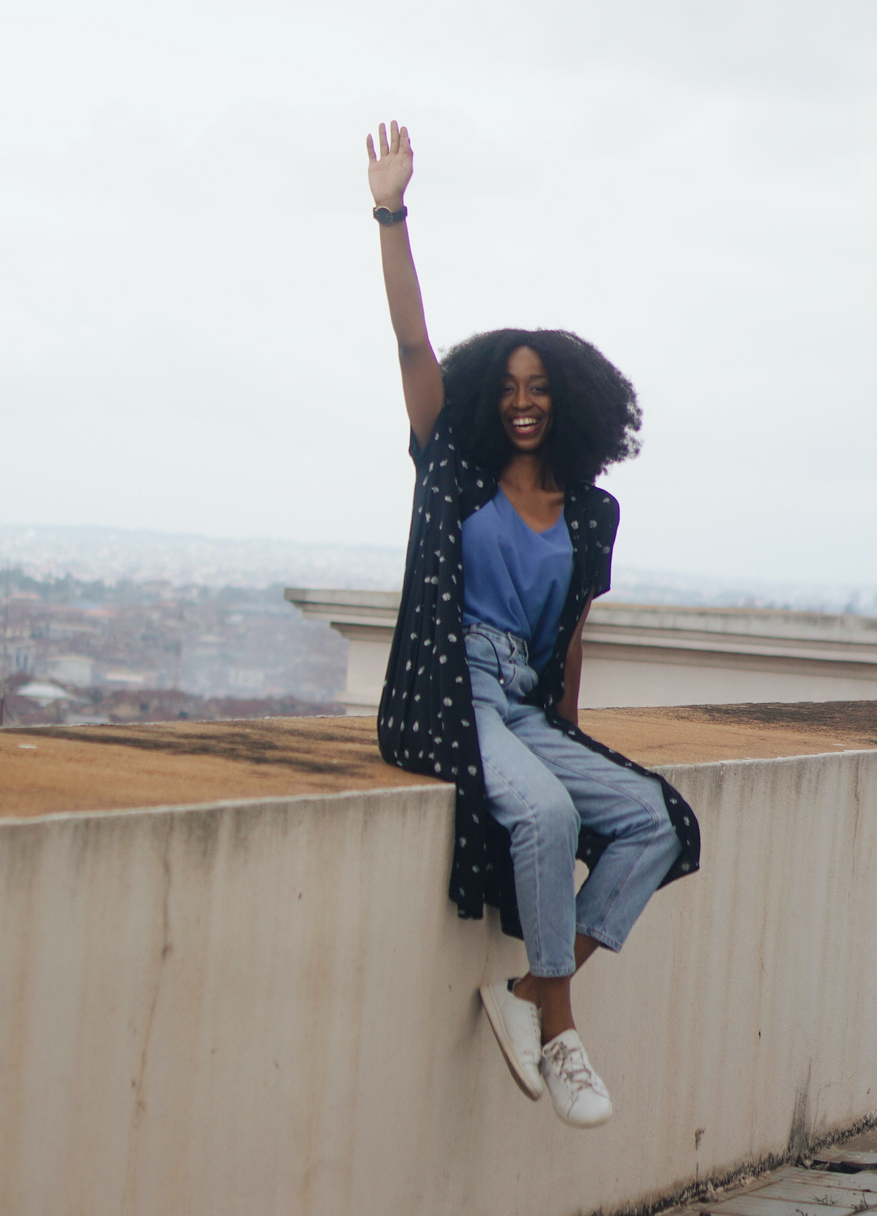 Nigerian lifestyle blogger Cassie Daves Sitting on the rooftop at Mapo hall Ibadan
