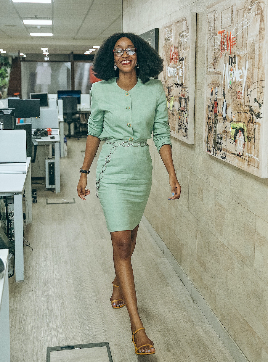 Nigerian style blogger Cassie Daves in a two piece vintage tweed green skirt suit