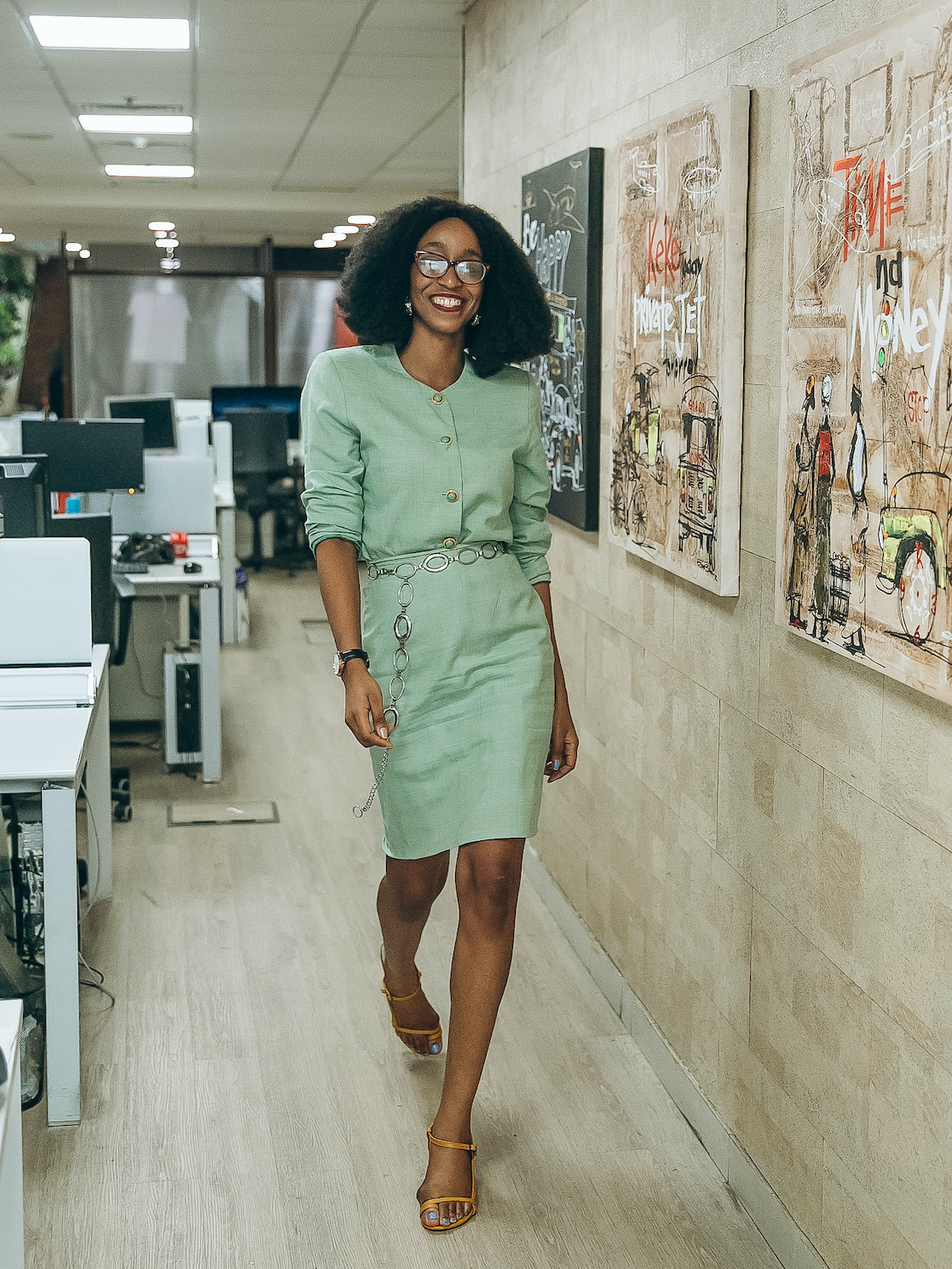 Nigerian style blogger Cassie Daves in a two piece vintage tweed green skirt suit